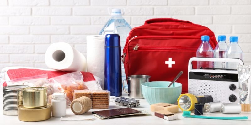 Hurricane preparedness supplies including food, water, emergency kit and household essentials