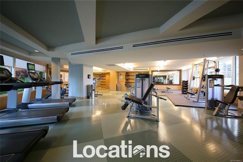 Allure Waikiki fitness center with cardio equipment